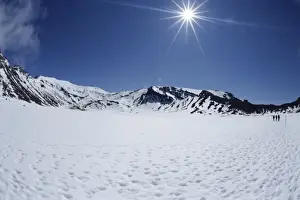 South Auckland Prints: Late winter hikers on snowfield in South Crater on Tongariro Crossing
