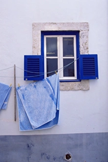Laundry hanging on line at window in the Moorish quarter of Alfama Laundry hanging on line at window in the Moorish quarter of Alfama