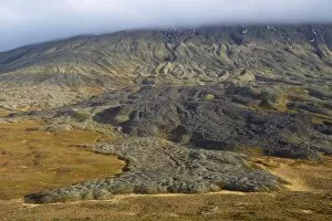 Lava flows on Mount Snaefellsjokull slopes, 1446m high volcano covered by ice