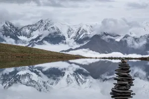Trekking Prints: Lenggacuo Lake reflects Daxue Mountain Range with Mount Gongga in the background in Sichuan