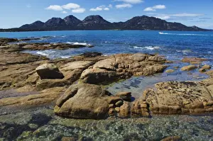 Lichen covered red granite rocks at the Hazards Mountain Range, Coles Bay