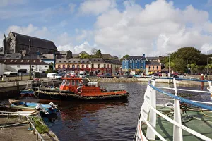 Munster Gallery: Lifeboat in harbour with town beyond