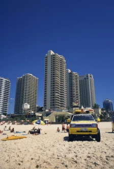 Gold Coast Prints: Lifeguards jeep on the beach at Surfers Paradise, with hotels and apartment blocks beyond