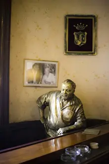 Bars Prints: Lifesize bronze statue of author Ernest Hemingway in bar El Floridita, Havana