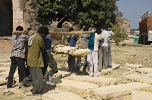 Co Operation Prints: Lifting by hand heavy stones for restoration work