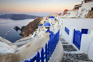 Blue Dome Prints: The last light of dusk over the Aegean Sea seen from the typical village of Oia, Santorini