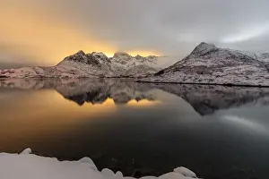 Svolvaer Prints: The light of the moon and snowy peaks reflected in the cold sea lit the night at Svolvaer