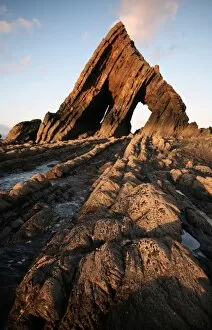 The light of the setting sun illuminates the unusual architecture of Blackchurch Rock