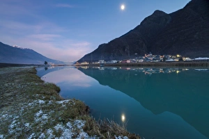 Sondrio Prints: Last light of sunset on Adda River and the village of Sirta Forcola, province of Sondrio