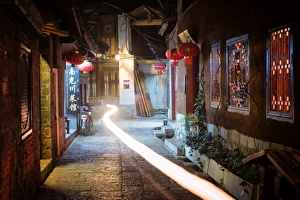 Motorbike Prints: Light trail in an alley at night in Lijiang Old Town