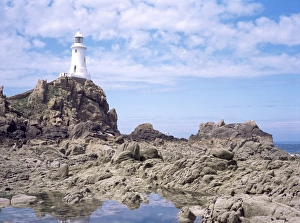 Cause Way Prints: Lighthouse from the causeway at low tide, Corbiere, St. Brelade, Jersey