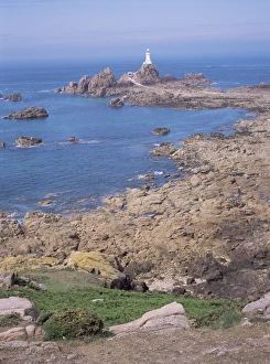 Corbiere Prints: Lighthouse from cliffs at low tide, Corbiere, St. Brelade, Jersey, Channel Islands