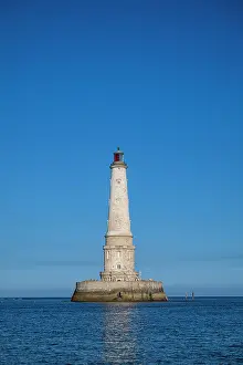 Beacon Prints: Lighthouse of Cordouan stands tall in the ocean under blue skies