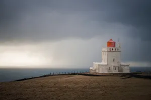 Stormy Prints: The lighthouse of Dyrholaey on a stormy day, southern coast of Iceland, Polar Regions