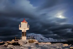 Reine Prints: Lighthouse and full moon in the Arctic night with the village of Reine in the background