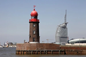 Lighthouse at old harbour, and Atlantic Hotel Sail City, Bremerhaven, Bremen
