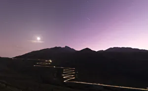 Silhouetted Gallery: Lights of car traces at dusk, Spluga Pass, Chiavenna Valley, Switzerland, Europe