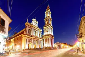 Brightness Prints: Lights of car trails at dusk on an empty road near Saint Francis church, Salta, Argentina