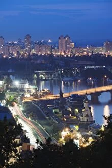Lights illuminating Podil district and Dnieper River area at night, Kiev, Ukraine, Europe