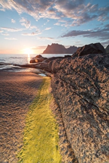 Uttakleiv Prints: Lights of the midnight sun on the rocks surrounding the blue sea