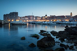Surrounding Wall Prints: The lights of old town Dubrovnik and its harbour during blue hour, Dubrovnik, Croatia