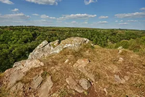 Gorge Prints: Limestone rocks sit along the edge of a cliff overlooking the green hills in Cheddar Gorge