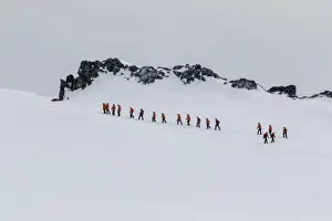 Orne Harbor Prints: Lindblad Expeditions guests from the National Geographic Explorer hiking at Orne Harbor