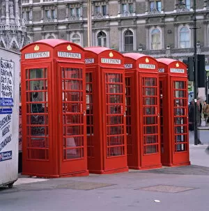 Booth Collection: A line of four red telephone boxes at Charing Cross, London, England, United Kingdom