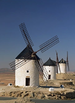 New Castile Prints: A line of windmills above the village of Consuegra