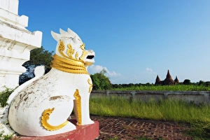 Bagan Prints: Lion statue and temple on Bagan plain, Bagan (Pagan), Myanmar (Burma), Asia