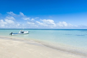 Little boat anchoring on a little islet in Haapai, Haapai Islands, Tonga, South Pacific, Pacific