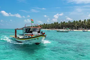 Union Territory Of India Prints: Little boats before a palm fringed white sand beach