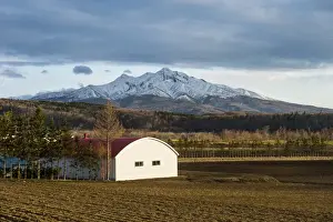 Barn Prints: Little farm before a snow capped mountain near the Shiretoko National Park, Hokkaido