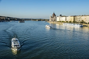 River Danube Prints: Little ferries on the River Danube in front of the Panorama of Pest, Budapest, Hungary