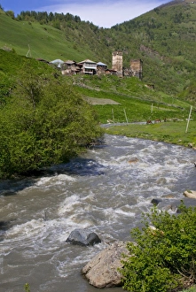 Mountain Village Prints: Little river running below a fortified mountain village, Svanetia, Georgia