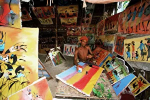 Tanzania Prints: Local artist with his Tingatinga paintings, Zanzibar, Tanzania, East Africa, Africa