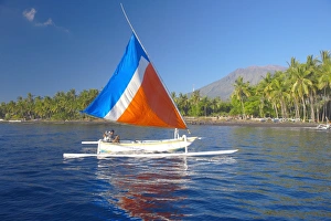 Enjoying Prints: Local fisherman on a traditional outrigger boat, Bali, Indonesia, Southeast Asia, Asia