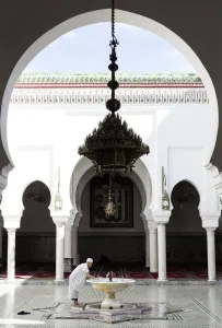 Typically Moroccan Prints: Local man washing in courtyard of Kairaouine Mosque (Mosque of al-Qarawiyyin), UNESCO