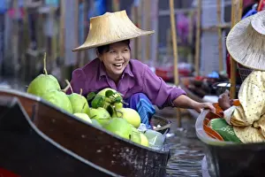 40 45 Years Prints: Local women share a joke at Damnoen Saduak Floating Market