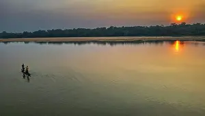 Paddling Prints: Locals in a canoe, Sangha River