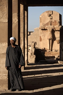 Thebes Prints: A lone figure stands amongst the Temples of Karnak, Thebes, UNESCO World Heritage Site