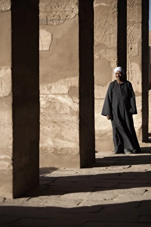 A lone figure stands amongst the Temples of Karnak, Thebes, UNESCO World Heritage Site
