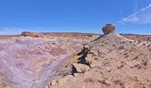 Outdoor Adventures Prints: A lone hoodoo rock on the edge of a ridge overlooking the Jim Camp Wash on the south end of Petrified Forest National