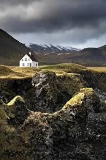 Snaefellsnes Peninsula Gallery: Lone house and sea stacks in stormy weather, Arnastapi, Snaefellsnes Peninsula, Iceland