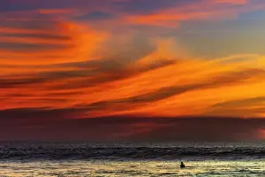 Nicoya Peninsula Prints: Lone surfer and sunset clouds off Playa Hermosa surf beach, southern Nicoya Peninsula