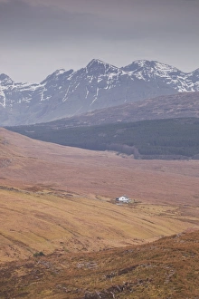 A lonely house sits in the shadow of the Cuillins on the Isle of Skye, Inner Hebrides, Scotland, United Kingdom, Europe