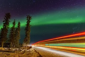 Northern Prints: Long exposure of Jeep lights under the Northern Lights on Great Slave Lake in Northwest Territories