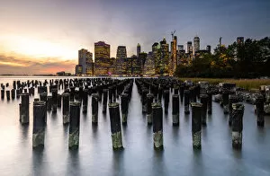 Typically American Gallery: Long exposure of the lights of Lower Manhattan during sunset as seen from Brooklyn Bridge Park
