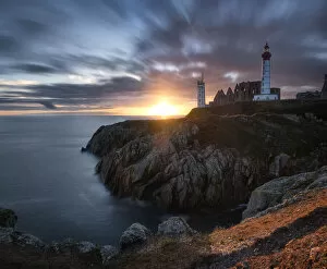 Direction Gallery: Long exposure panorama of a sunset with coloured clouds at Saint Mathieu Lighthouse, Finistere