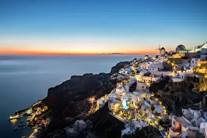 Townscape Prints: Long exposure sunset view over the whitewashed buildings and windmills of Oia, Santorini
